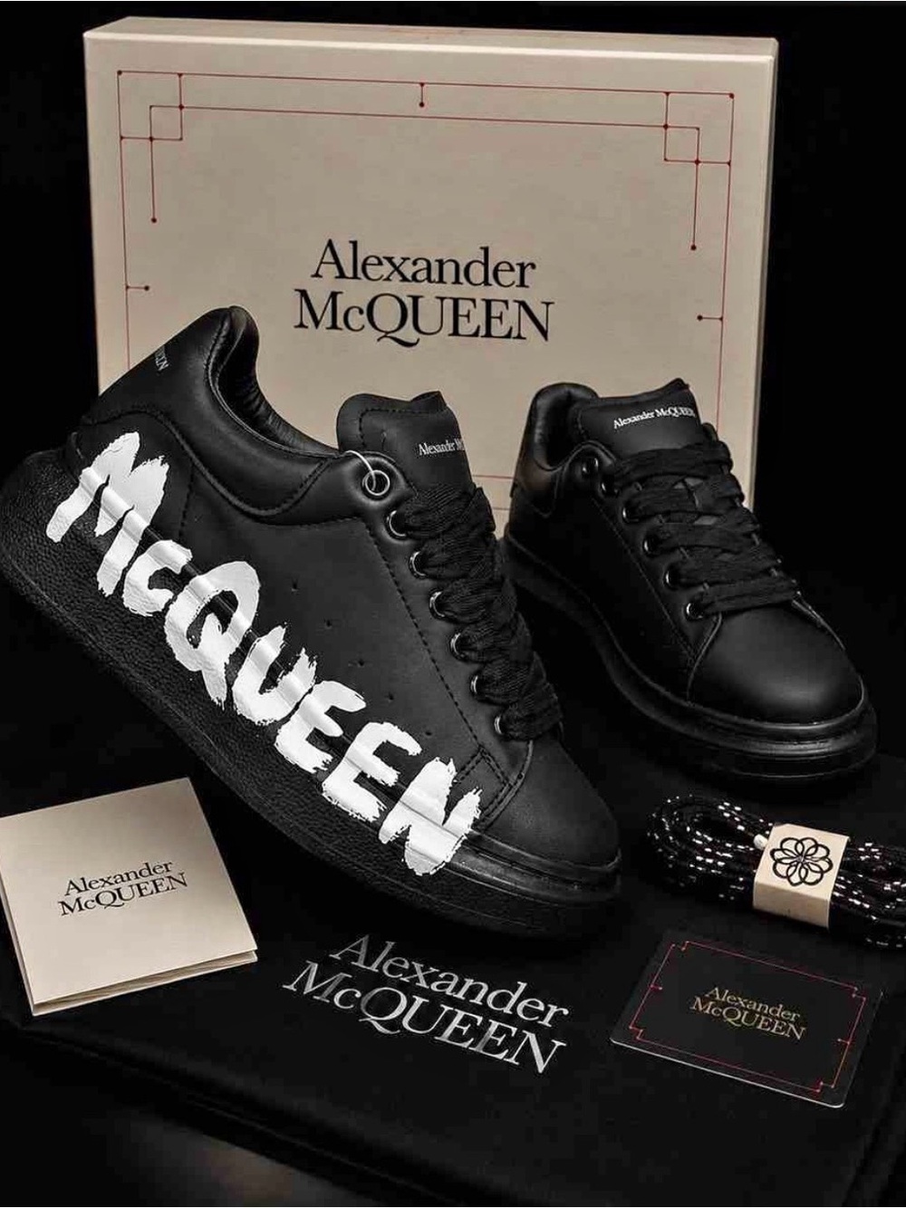 Alexander McQueen Black Leather Sneakers with White 'McQueen' Graphic N/A